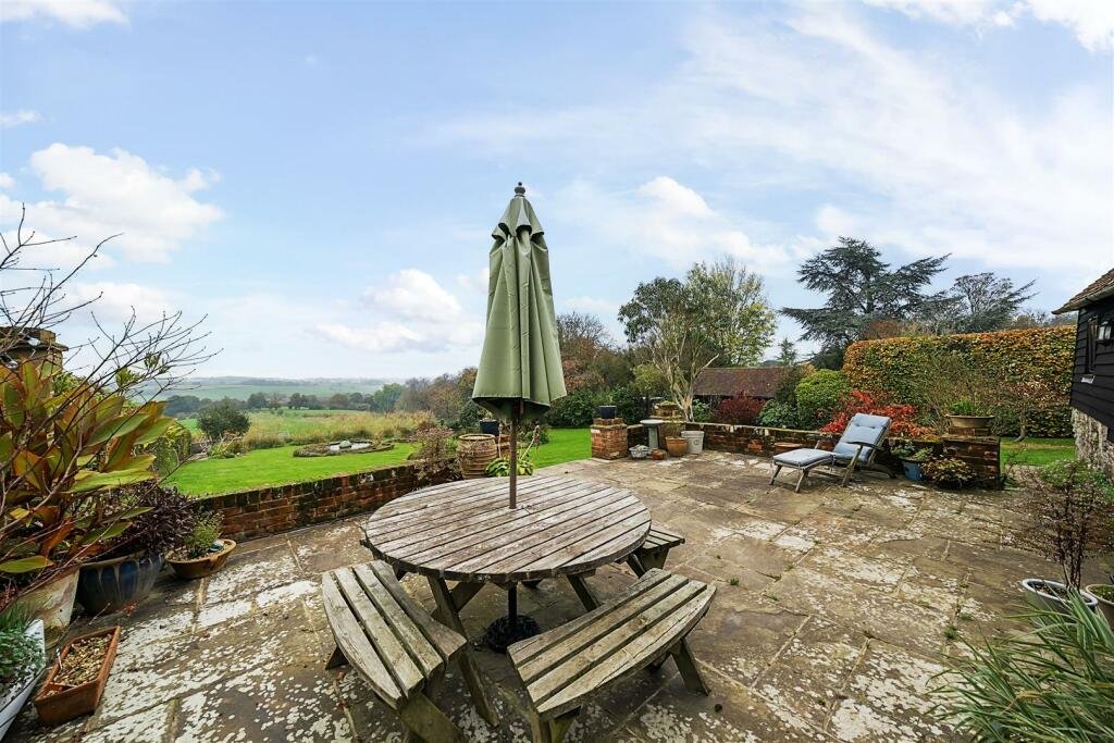 This £945k East Sussex barn home has 3 beds, a vineyard, 12.5 acres, stunning valley views and its own private airstrip and hangar for microlight aircraft.