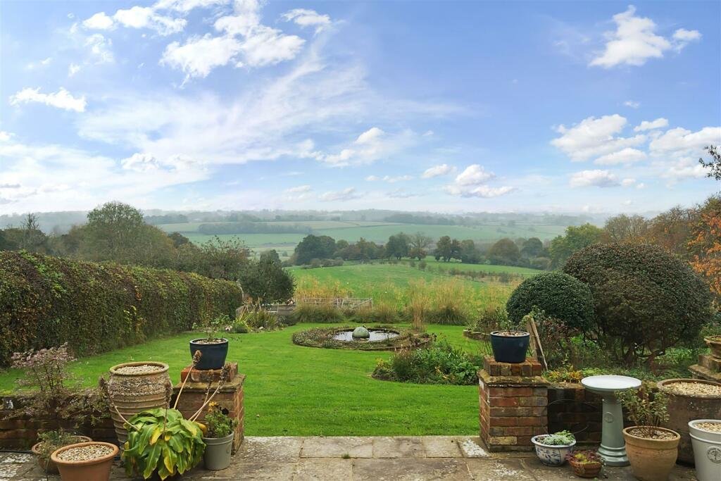 This £945k East Sussex barn home has 3 beds, a vineyard, 12.5 acres, stunning valley views and its own private airstrip and hangar for microlight aircraft.