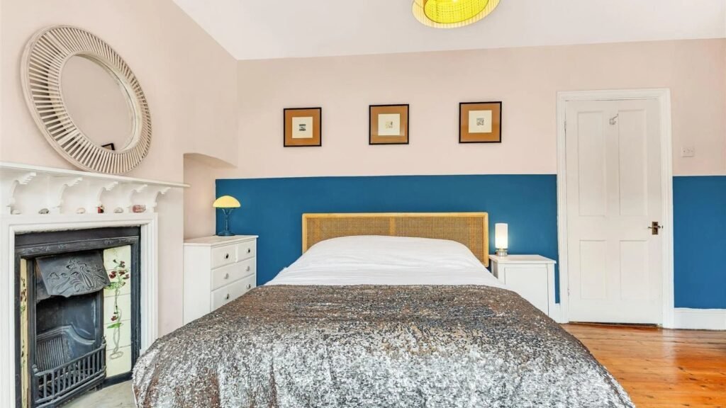 A Victorian semi in Bedford with three bedrooms, a stylish courtyard, and a fully equipped salon outbuilding is on sale for £450,000 offering charm and versatility.