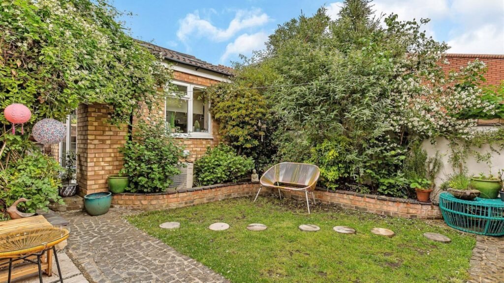 A Victorian semi in Bedford with three bedrooms, a stylish courtyard, and a fully equipped salon outbuilding is on sale for £450,000 offering charm and versatility.