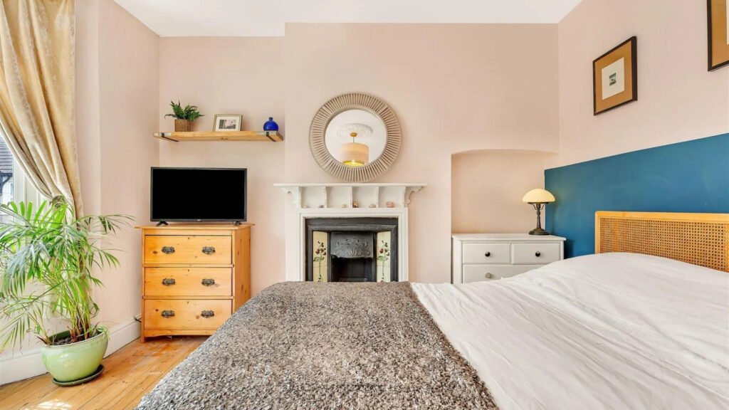 A Victorian semi in Bedford with three bedrooms, a stylish courtyard, and a fully equipped salon outbuilding is on sale for £450,000 offering charm and versatility.