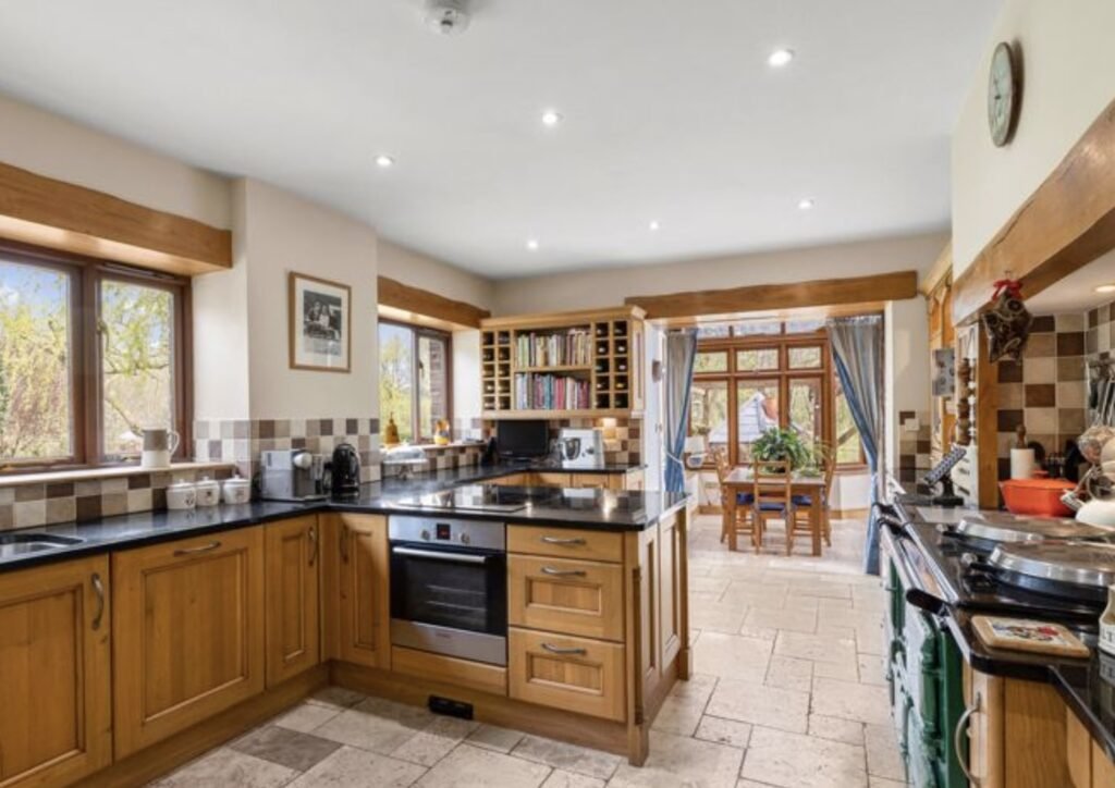 A £1.5m riverside home in Wales with a working water wheel, lush gardens, fishing rights and a two-bed annexe offers luxury countryside living on nearly 14 acres.