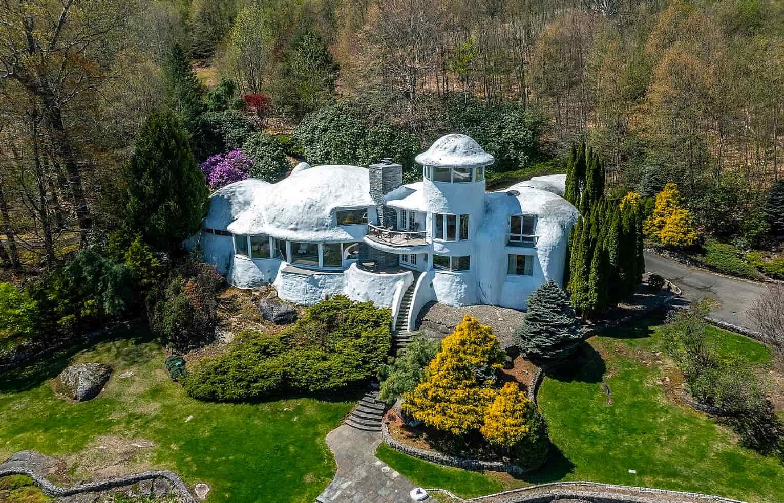 The £1.1m mushroom house in Connecticut offers 23.5 acres of woodland, lake views, a pool, and artistic architecture just a scenic drive from New York City.