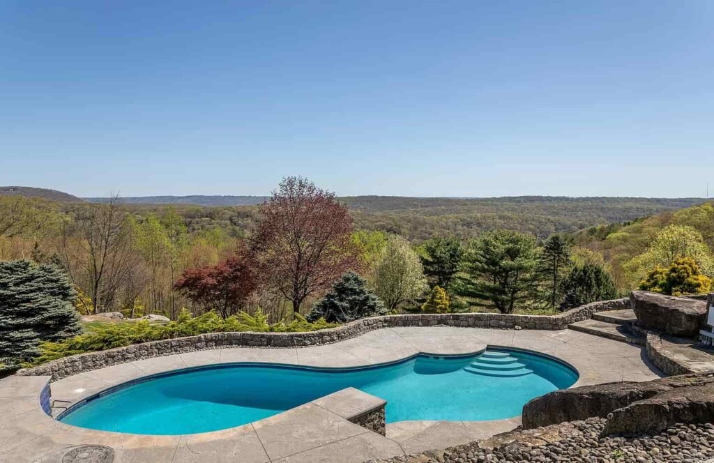 The £1.1m mushroom house in Connecticut offers 23.5 acres of woodland, lake views, a pool, and artistic architecture just a scenic drive from New York City.