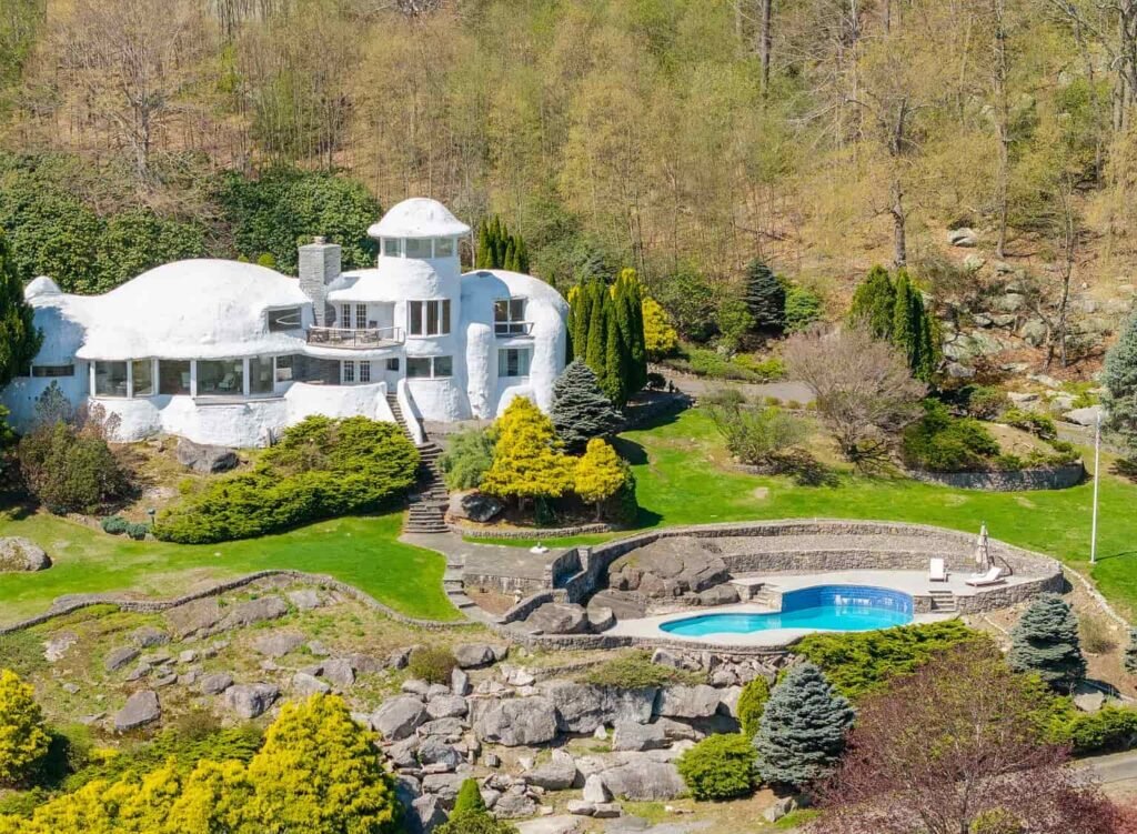 The £1.1m mushroom house in Connecticut offers 23.5 acres of woodland, lake views, a pool, and artistic architecture just a scenic drive from New York City.
