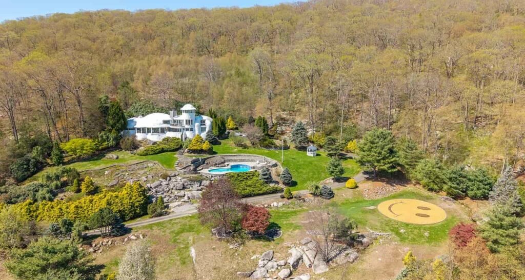 The £1.1m mushroom house in Connecticut offers 23.5 acres of woodland, lake views, a pool, and artistic architecture just a scenic drive from New York City.