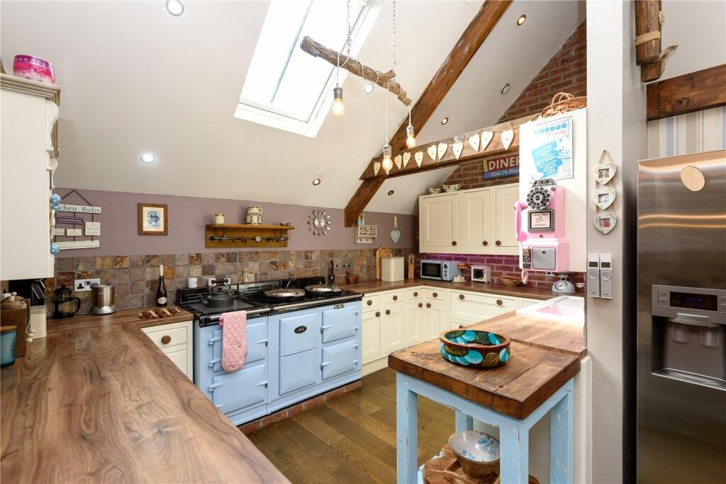 A detailed model village in scenic Polperro, Cornwall is for sale at £710k including a 3-bed home, mini harbour, railway and folklore exhibit attracting thousands yearly.