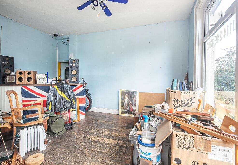 Snap up a three-bed Sheffield home with huge potential for just £130K. It’s packed with clutter and mold, but comes with a vintage retail unit and prime location.