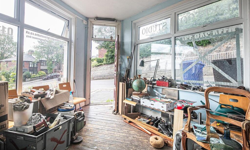 Snap up a three-bed Sheffield home with huge potential for just £130K. It’s packed with clutter and mold, but comes with a vintage retail unit and prime location.