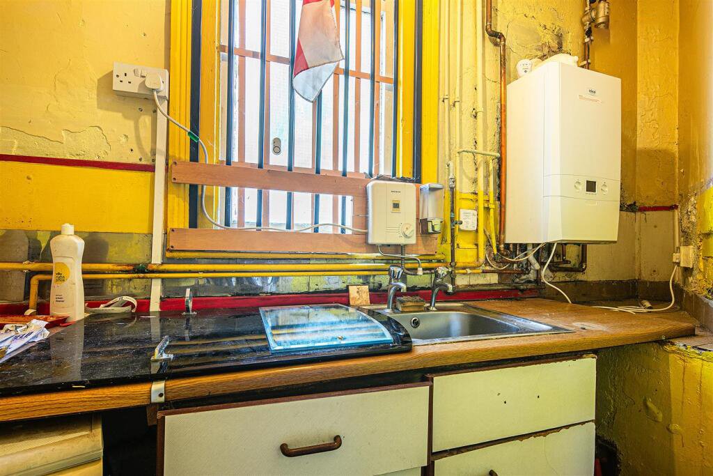 Snap up a three-bed Sheffield home with huge potential for just £130K. It’s packed with clutter and mold, but comes with a vintage retail unit and prime location.