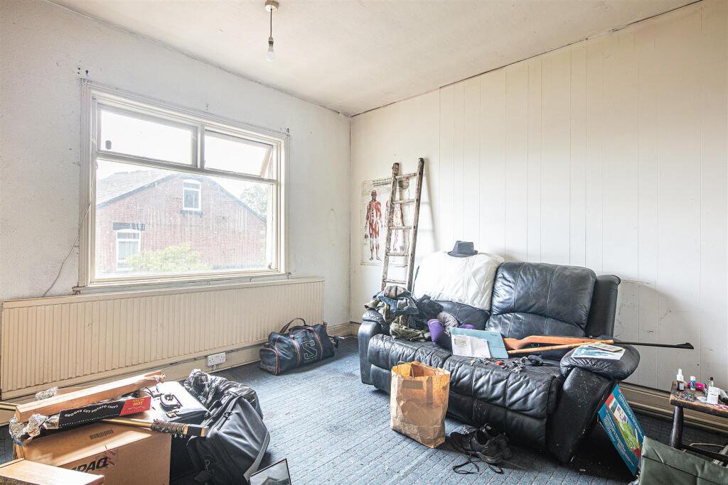 Snap up a three-bed Sheffield home with huge potential for just £130K. It’s packed with clutter and mold, but comes with a vintage retail unit and prime location.