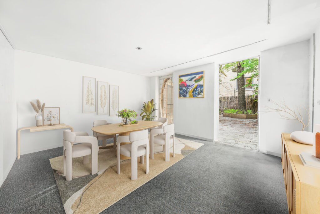 An iconic New York bubble house in Lenox Hill is on the market for \$5.75M, boasting curved glass windows, minimalist interiors, and a lush walled garden.