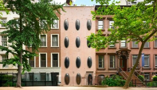 An iconic New York bubble house in Lenox Hill is on the market for \$5.75M, boasting curved glass windows, minimalist interiors, and a lush walled garden.