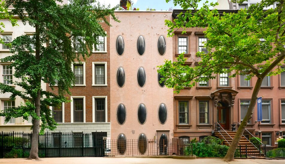 An iconic New York bubble house in Lenox Hill is on the market for \$5.75M, boasting curved glass windows, minimalist interiors, and a lush walled garden.