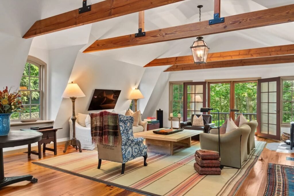 A \$3.25m Massachusetts estate features a quarry-carved pool with a 16ft waterfall, lush gardens, a canopy porch, and serene luxury across 3,459 sq ft of private grounds.