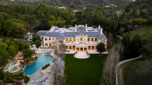 Paris Hilton buys Mark Wahlberg’s \$63m Beverly Park mansion with 12 bedrooms, pro gym, golf course, and top-tier privacy after losing her last home in LA fires.