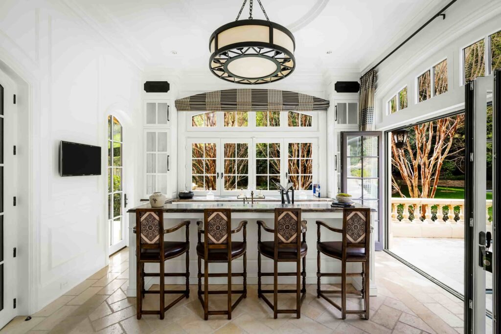 Paris Hilton buys Mark Wahlberg’s \$63m Beverly Park mansion with 12 bedrooms, pro gym, golf course, and top-tier privacy after losing her last home in LA fires.