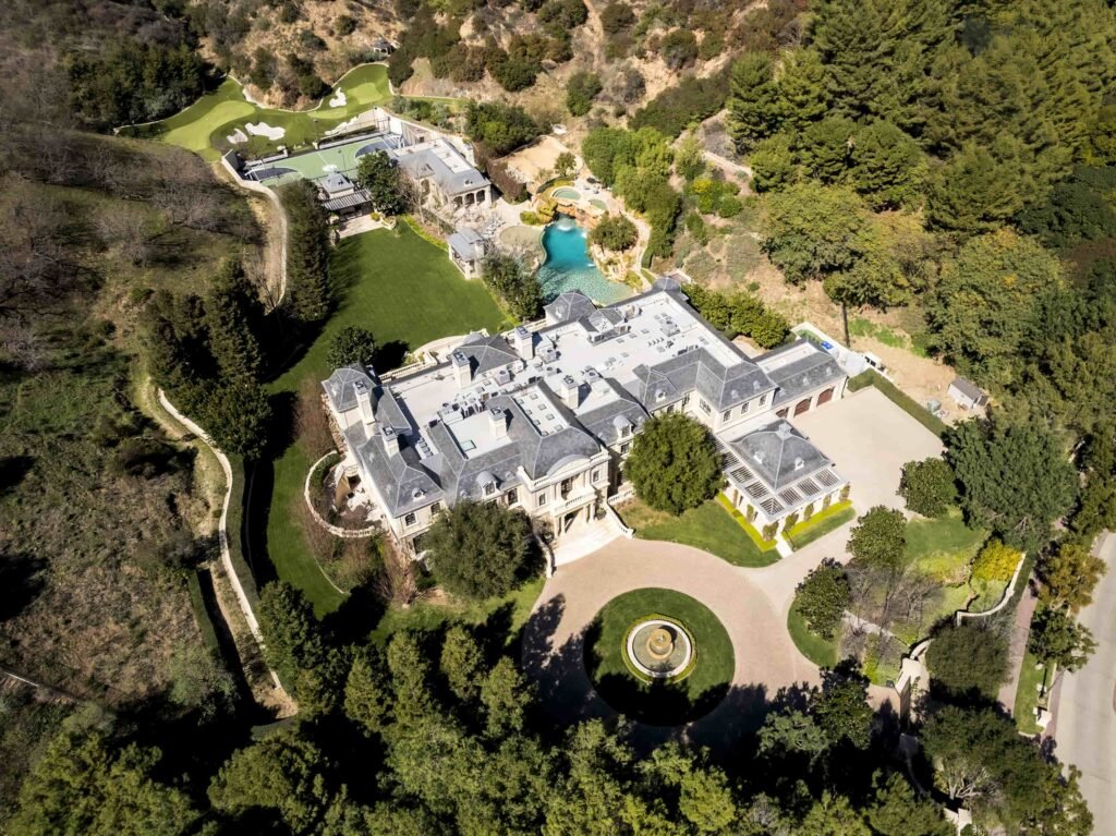 Paris Hilton buys Mark Wahlberg’s \$63m Beverly Park mansion with 12 bedrooms, pro gym, golf course, and top-tier privacy after losing her last home in LA fires.