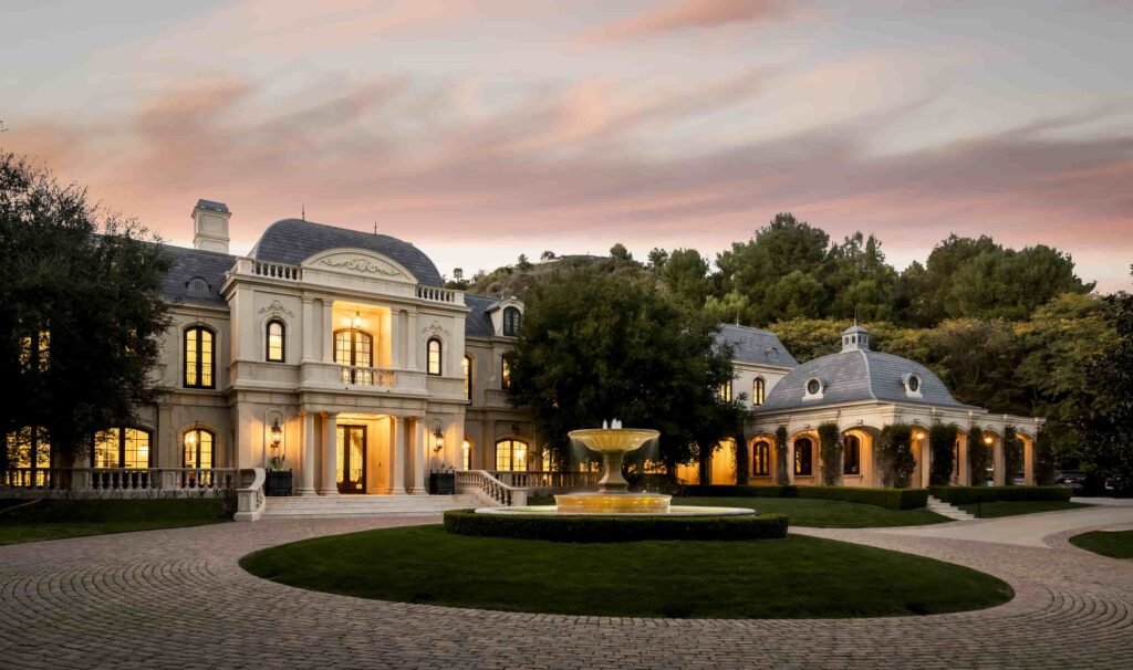 Paris Hilton buys Mark Wahlberg’s \$63m Beverly Park mansion with 12 bedrooms, pro gym, golf course, and top-tier privacy after losing her last home in LA fires.