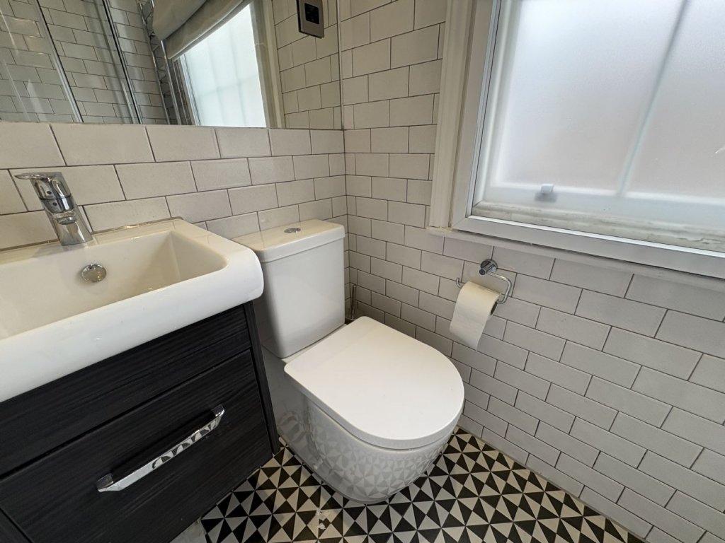 Ingenious fold-away bed and modern shower maximize space in this £1,400 Baker Street studio flat, where you can cook from bed and enjoy bills included for £63 weekly.