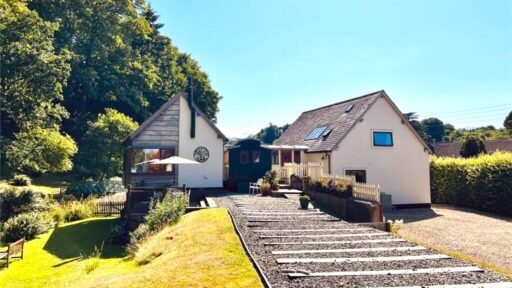 This £795,000 eco home in Somerset features a Victorian train carriage dining room, sits on a historic railway, and blends quirky charm with countryside tranquility.