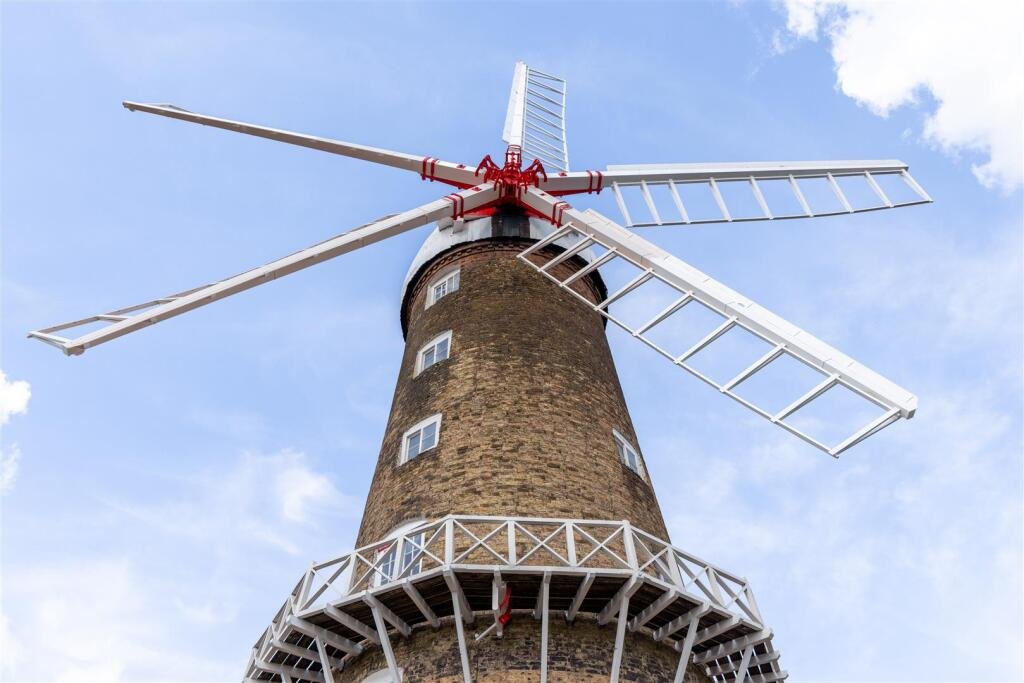 Historic Maud Foster Windmill in Lincolnshire is for sale at £549,950 with a penthouse home, shop, flour mill, and potential for a wedding venue or holiday let.