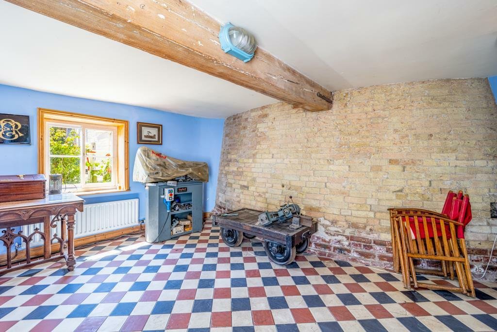 Historic Maud Foster Windmill in Lincolnshire is for sale at £549,950 with a penthouse home, shop, flour mill, and potential for a wedding venue or holiday let.