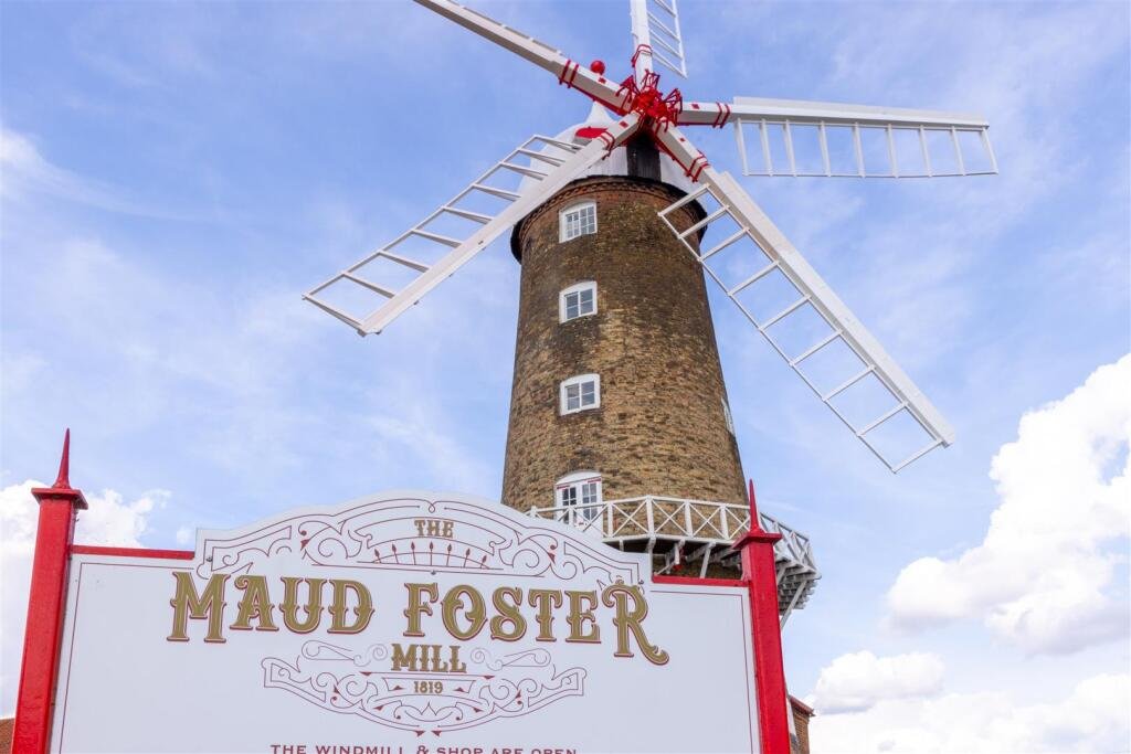 Historic Maud Foster Windmill in Lincolnshire is for sale at £549,950 with a penthouse home, shop, flour mill, and potential for a wedding venue or holiday let.