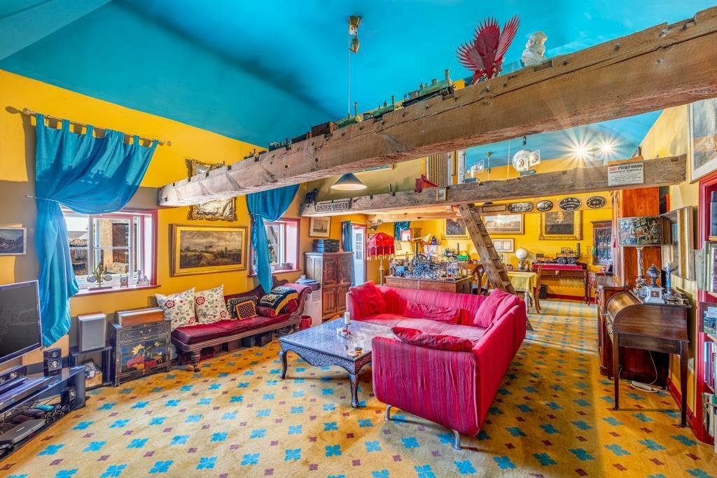 Historic Maud Foster Windmill in Lincolnshire is for sale at £549,950 with a penthouse home, shop, flour mill, and potential for a wedding venue or holiday let.