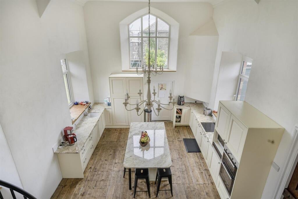 A restored 1876 schoolhouse in Devon with church views and a graveyard garden hits the market for £525,000, offering charm, history, and countryside tranquility.