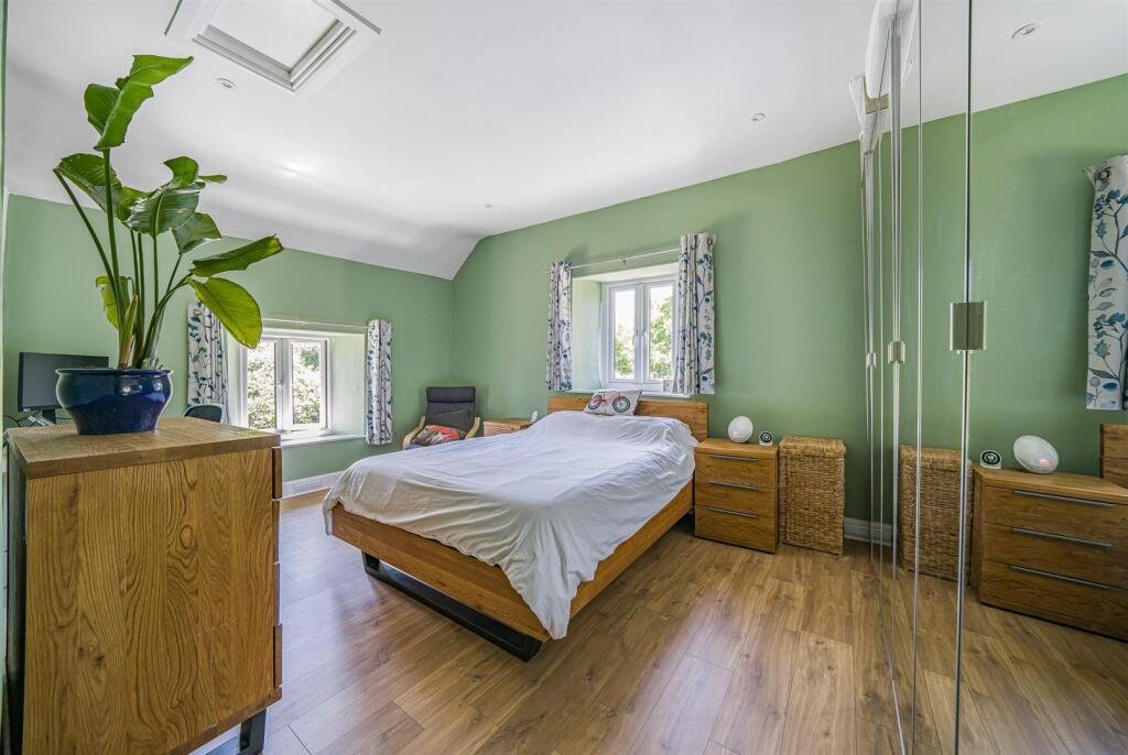 A restored 1876 schoolhouse in Devon with church views and a graveyard garden hits the market for £525,000, offering charm, history, and countryside tranquility.