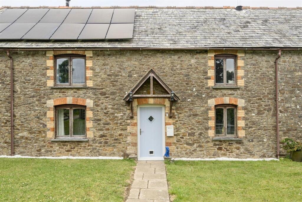 A restored 1876 schoolhouse in Devon with church views and a graveyard garden hits the market for £525,000, offering charm, history, and countryside tranquility.