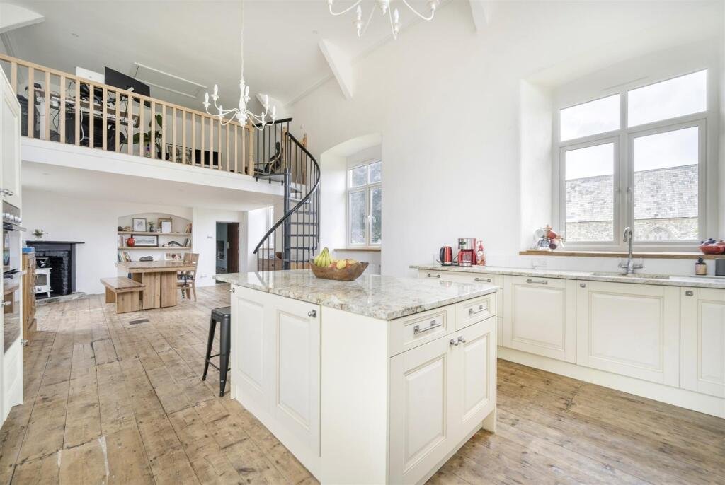 A restored 1876 schoolhouse in Devon with church views and a graveyard garden hits the market for £525,000, offering charm, history, and countryside tranquility.