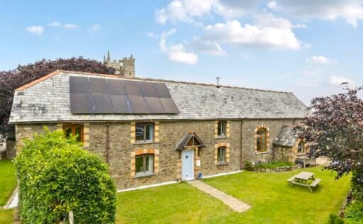 A restored 1876 schoolhouse in Devon with church views and a graveyard garden hits the market for £525,000, offering charm, history, and countryside tranquility.