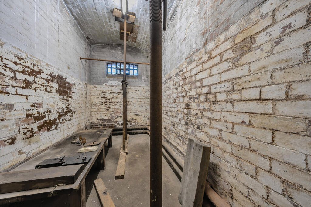 A historic 1887 police station in Marple with its own cell is for sale at £165,000, offering planning approval to convert it into a unique two-bedroom character home.