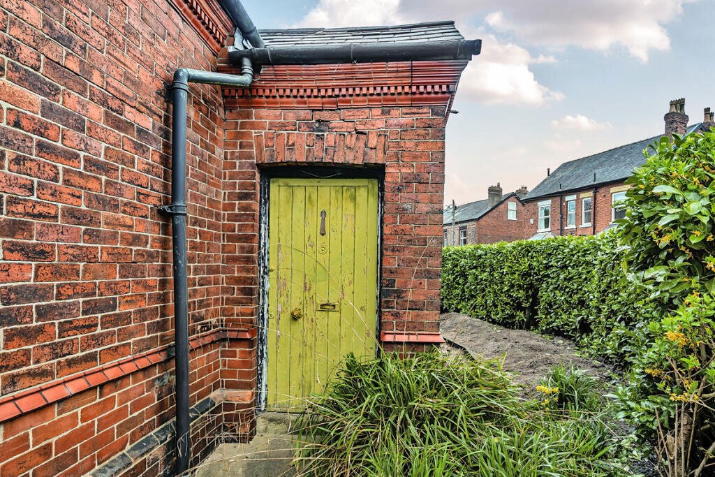 A historic 1887 police station in Marple with its own cell is for sale at £165,000, offering planning approval to convert it into a unique two-bedroom character home.
