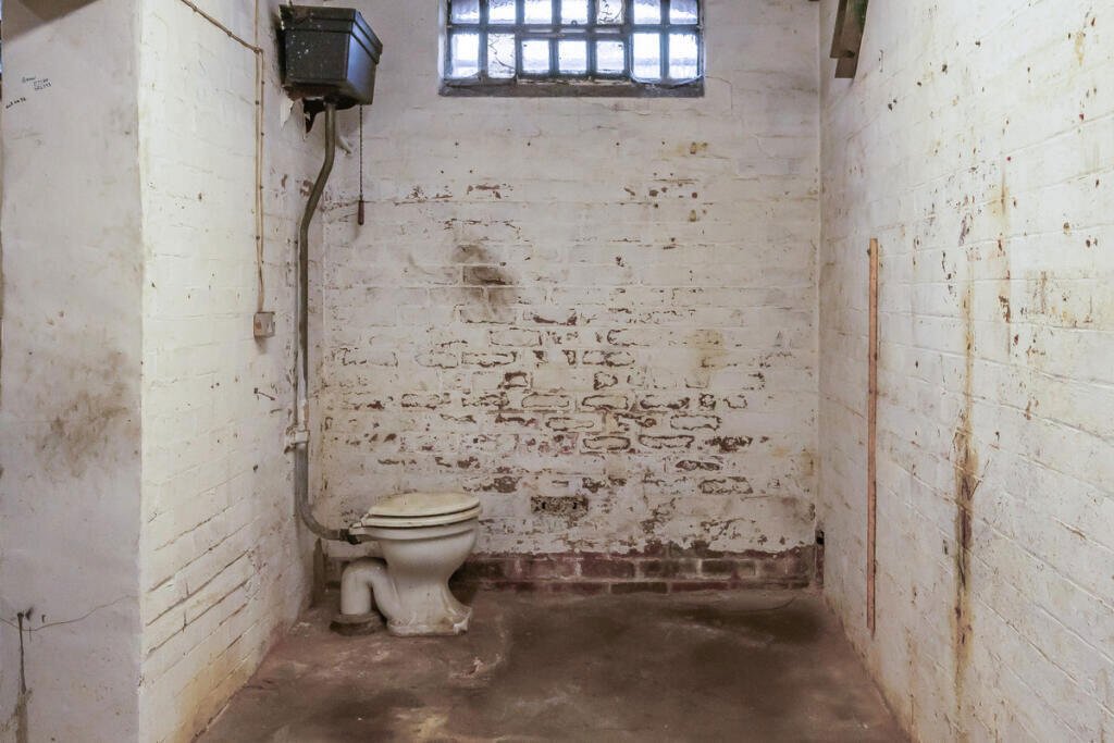 A historic 1887 police station in Marple with its own cell is for sale at £165,000, offering planning approval to convert it into a unique two-bedroom character home.