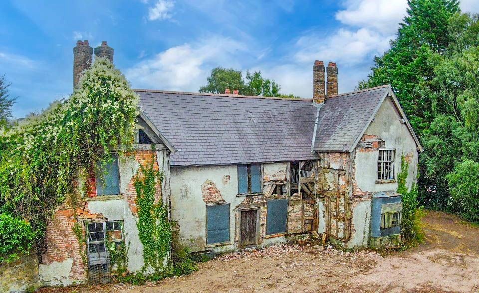 A 500 year old Grade II listed house in Ruabon near Wrexham is up for auction at £120000 offering historic charm and development potential but needing major restoration.