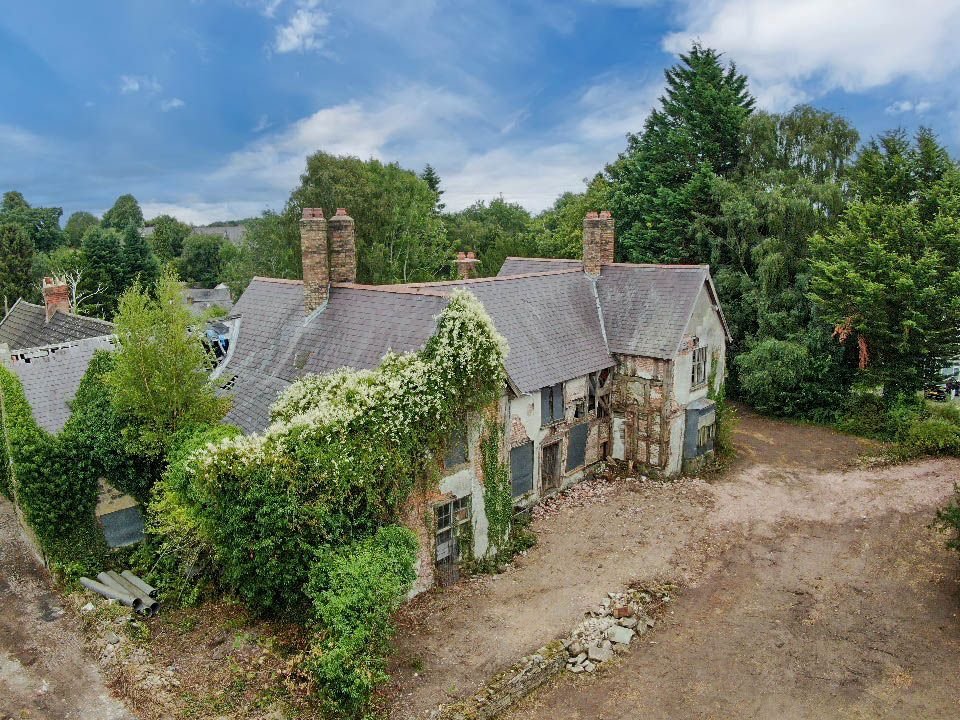 A 500 year old Grade II listed house in Ruabon near Wrexham is up for auction at £120000 offering historic charm and development potential but needing major restoration.