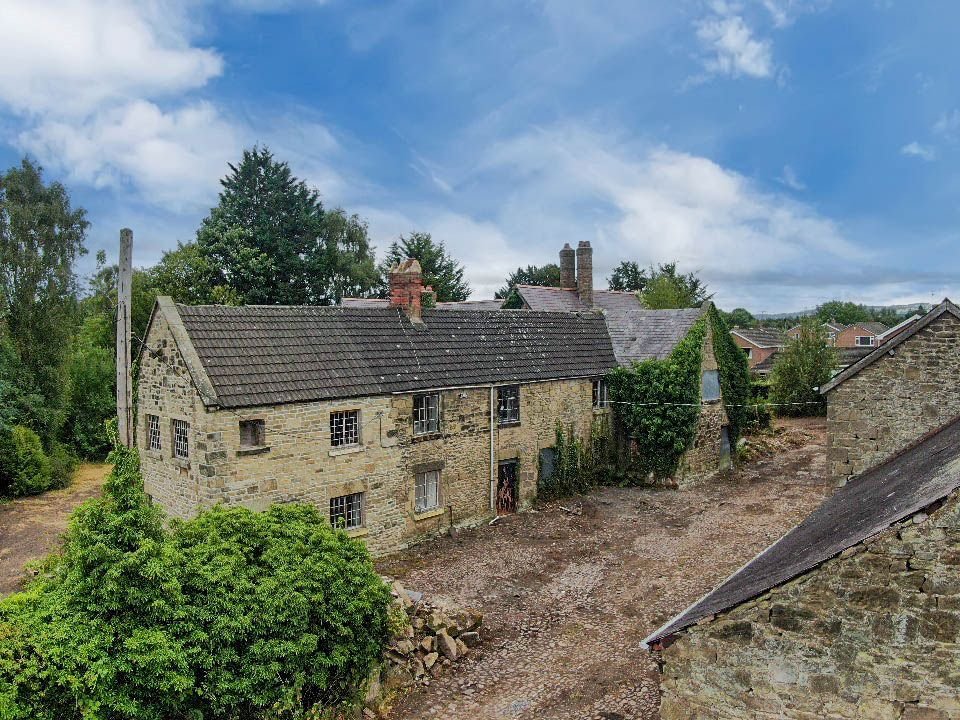 A 500 year old Grade II listed house in Ruabon near Wrexham is up for auction at £120000 offering historic charm and development potential but needing major restoration.