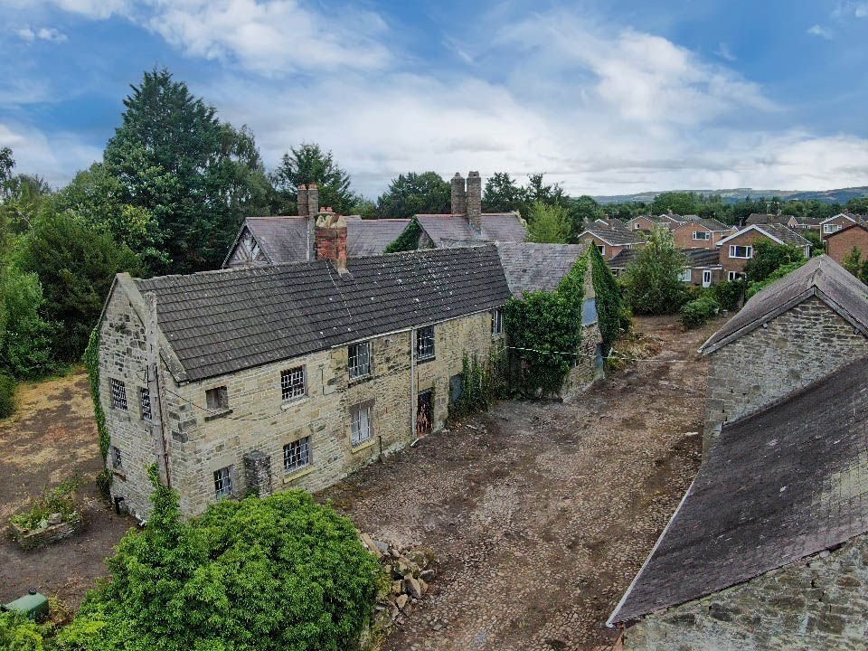 A 500 year old Grade II listed house in Ruabon near Wrexham is up for auction at £120000 offering historic charm and development potential but needing major restoration.