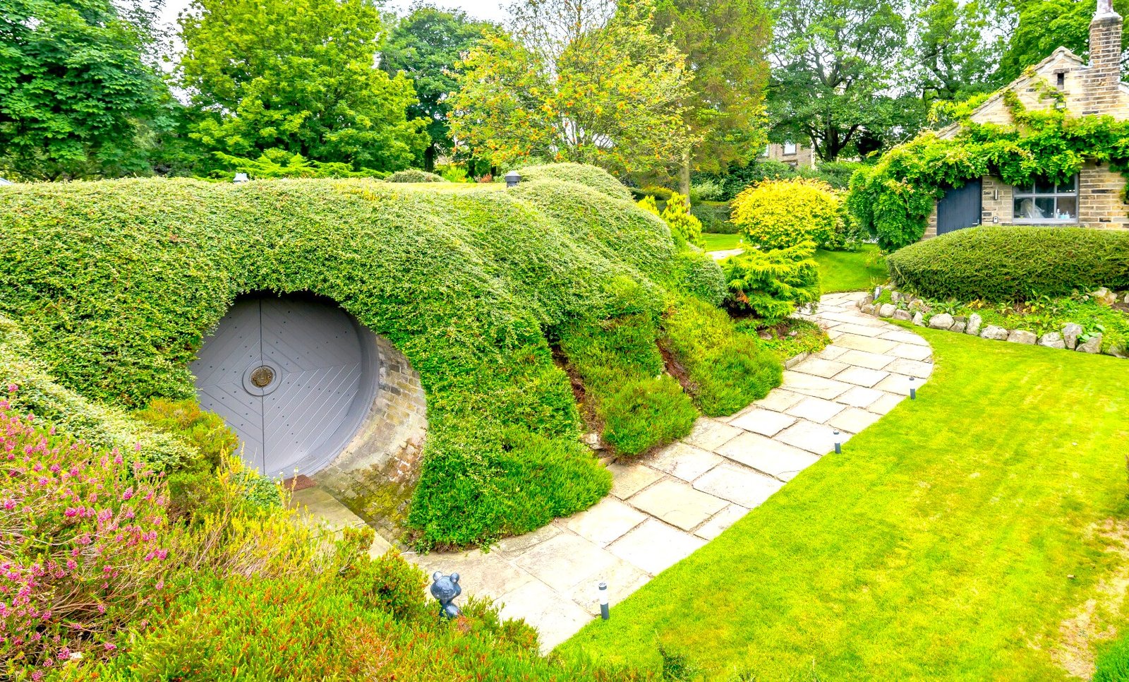 Underhill, Britain’s first modern earth sheltered home, blends Tolkien charm with luxury, featuring a pool, cave snug and breathtaking Peak District countryside views.