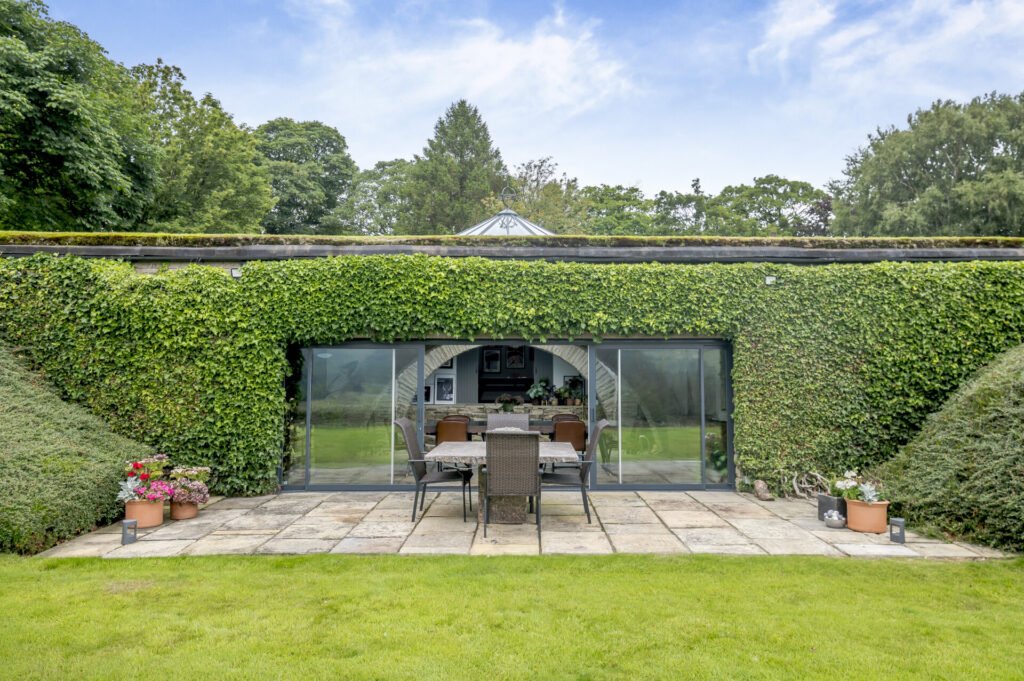 Underhill, Britain’s first modern earth sheltered home, blends Tolkien charm with luxury, featuring a pool, cave snug and breathtaking Peak District countryside views.