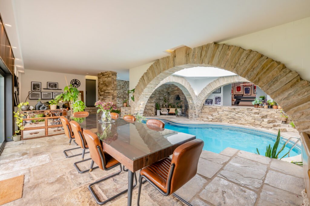 Underhill, Britain’s first modern earth sheltered home, blends Tolkien charm with luxury, featuring a pool, cave snug and breathtaking Peak District countryside views.