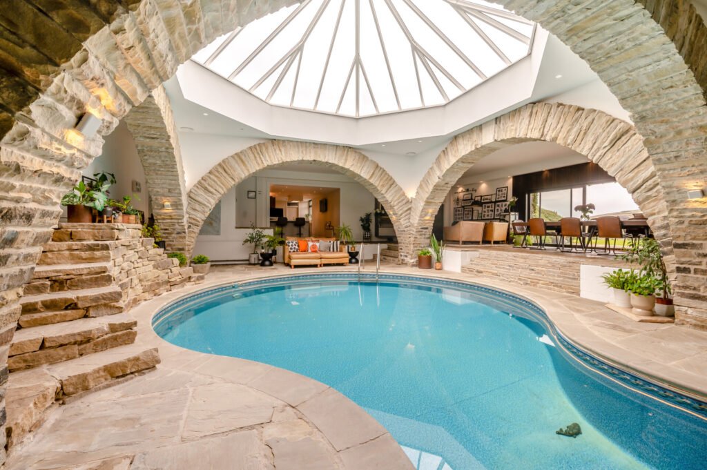 Underhill, Britain’s first modern earth sheltered home, blends Tolkien charm with luxury, featuring a pool, cave snug and breathtaking Peak District countryside views.