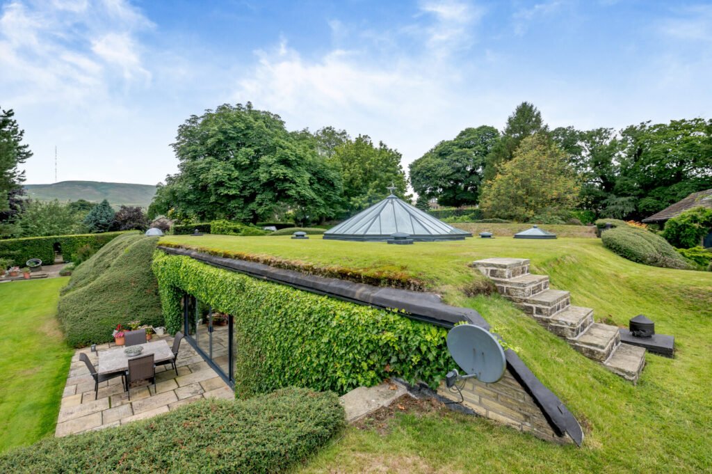 Underhill, Britain’s first modern earth sheltered home, blends Tolkien charm with luxury, featuring a pool, cave snug and breathtaking Peak District countryside views.
