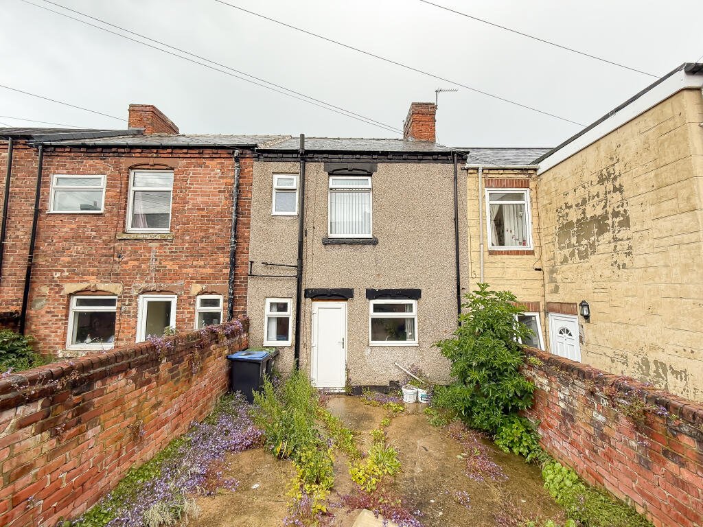 This £5,000 ghost town terrace in Horden, Durham is a loner's dream and a renovator’s project, with two bedrooms, overgrown garden and eerie post-mining charm.