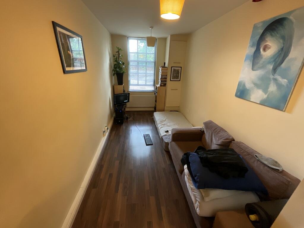 A £60,000 Sheffield studio dubbed a hallway hits the market with just 21 square meters of space, a floor mattress office setup and strong rental yield for investors.