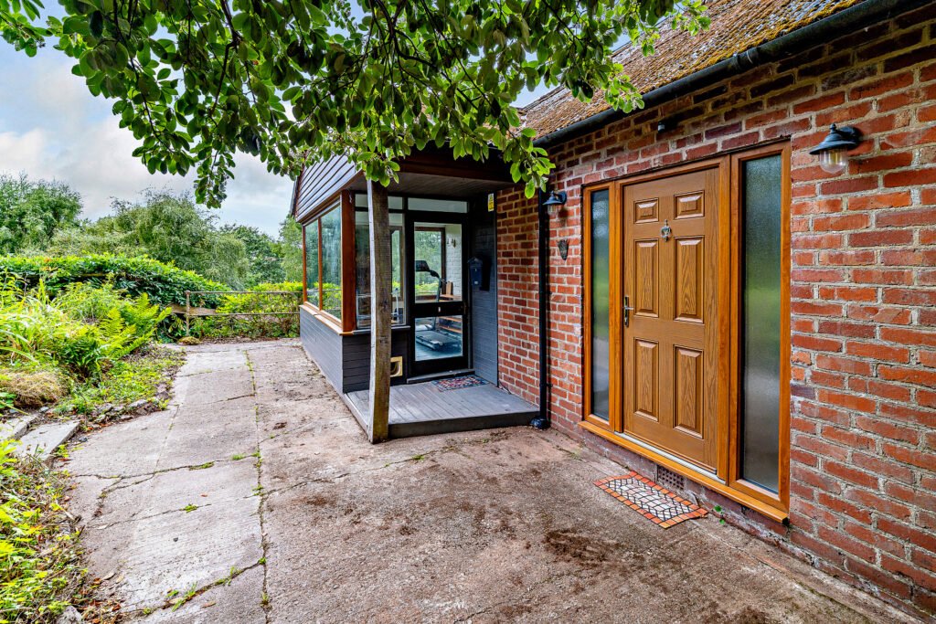 Secluded £520k woodland home in Shrewsbury with two bedrooms nearly one acre of gardens rare plants historic mine features and stunning views offers ultimate privacy.