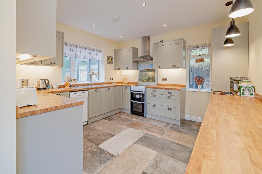 Secluded £520k woodland home in Shrewsbury with two bedrooms nearly one acre of gardens rare plants historic mine features and stunning views offers ultimate privacy.
